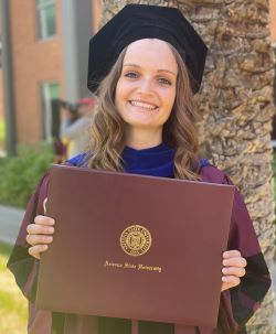 Photo of Olivia Davis Holding her Diploma