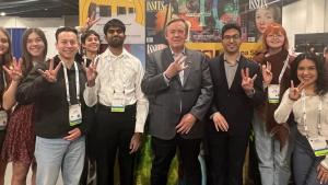 Photo of Michael Crow with  ASU Students at AAAS 2024