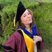 Photo of Dina Ziganshina in her cap and gown