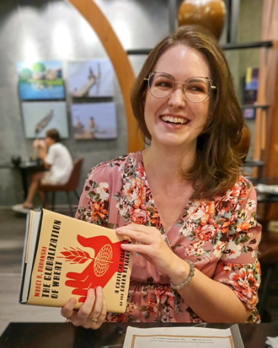 Photo of Marci Baranski holding her book