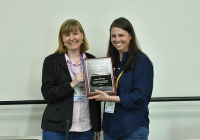 Photo of Sara Brownell receiving award