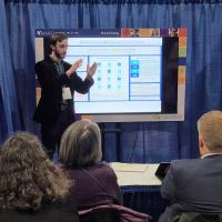 Photo of Cole Nichols presenting at AAAS