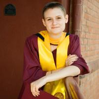 Photo of Rae Mills in her cap and gown