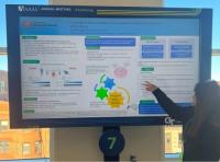 Photo of Aida Moavahed presenting her eposter at AAAS 2025