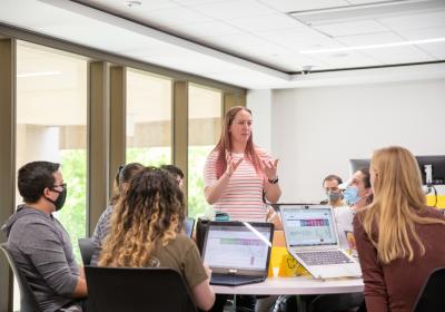 Photo of Emma Goodwin teaching a group of students