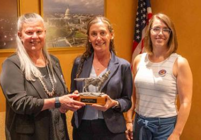 photo of Leah Gerber being given her Spirit of Defenders Award 